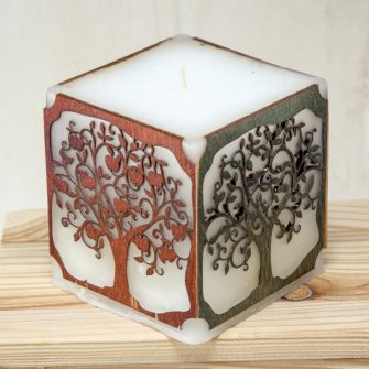 Candle with colored wooden inlay
